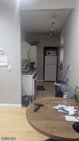 a room with a wooden floor and white walls