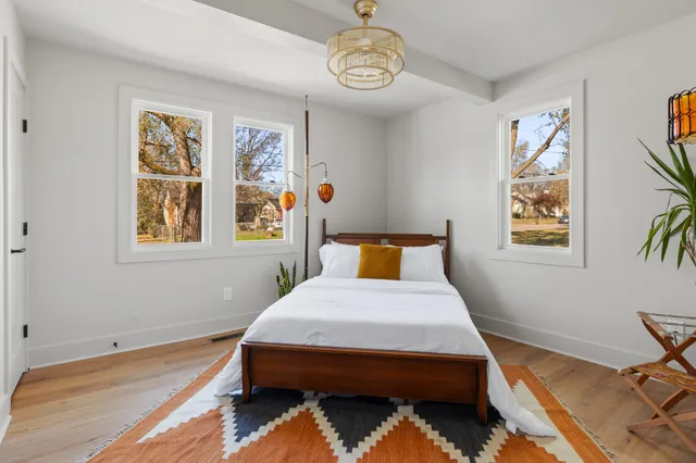 a bedroom with a bed and a table in it