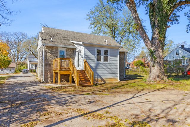 a view of a house with snow on the background