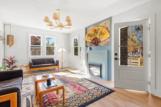 a bedroom with furniture and a fireplace