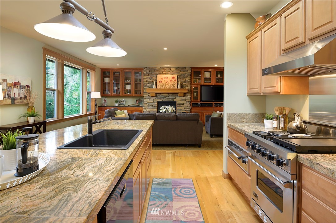 9203 Park Road Edmonds, WA 98020 - Photo 14 of 40 a kitchen with stainless steel appliances granite countertop a sink stove and refrigerator