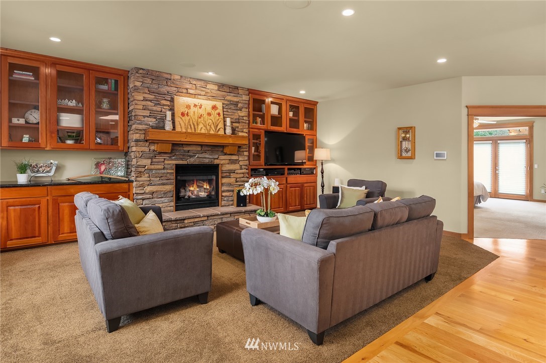 9203 Park Road Edmonds, WA 98020 - Photo 18 of 40 a living room with furniture and a fireplace