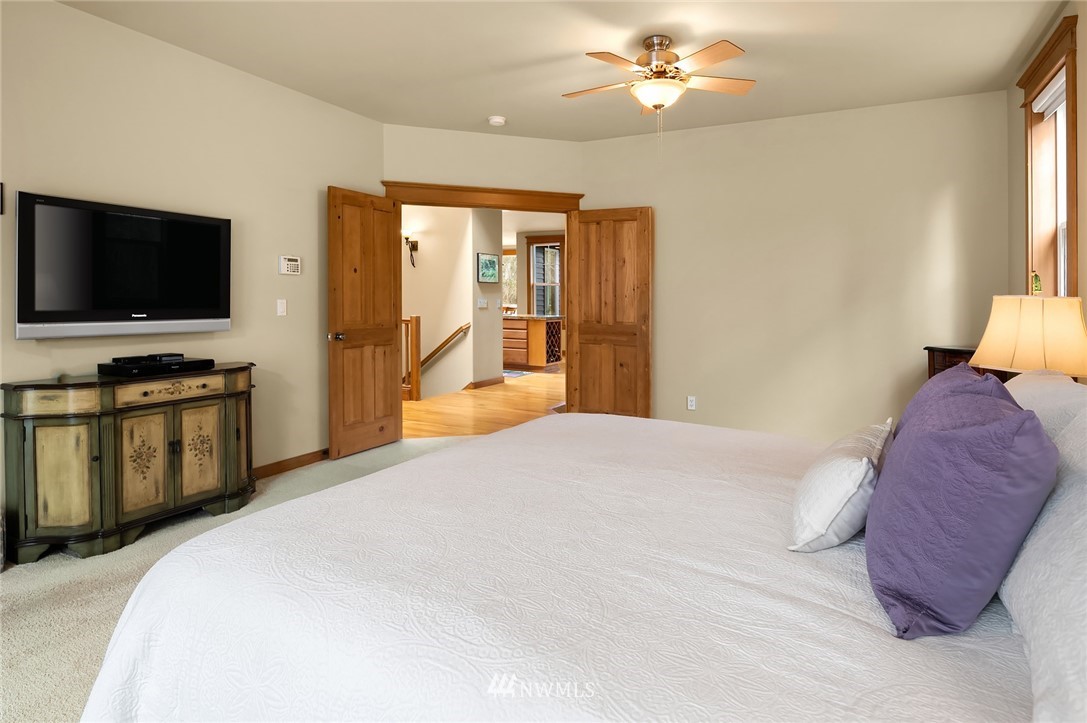 9203 Park Road Edmonds, WA 98020 - Photo 22 of 40 a bedroom with a bed and a flat screen tv