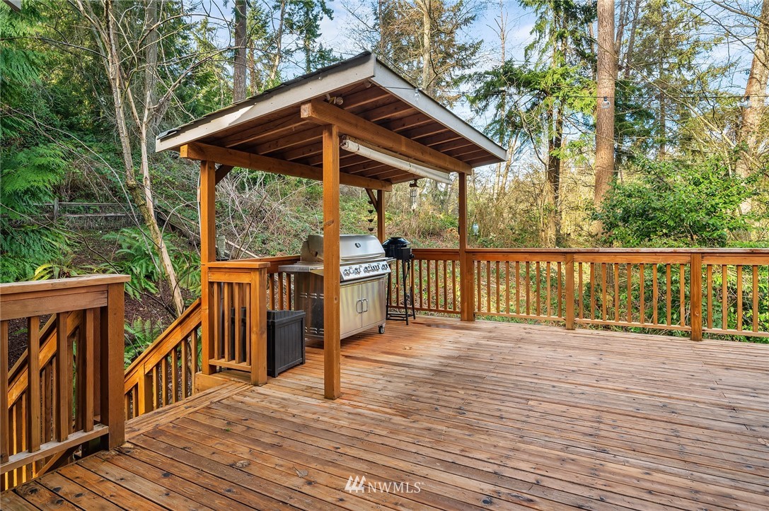 9203 Park Road Edmonds, WA 98020 - Photo 38 of 40 a deck view with a wooden deck and floor to ceiling window