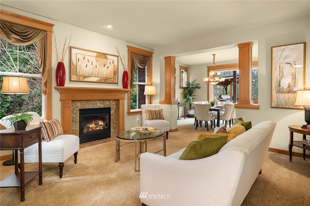 9203 Park Road Edmonds, WA 98020 - Photo 7 of 40 a living room with furniture a rug a fireplace and windows