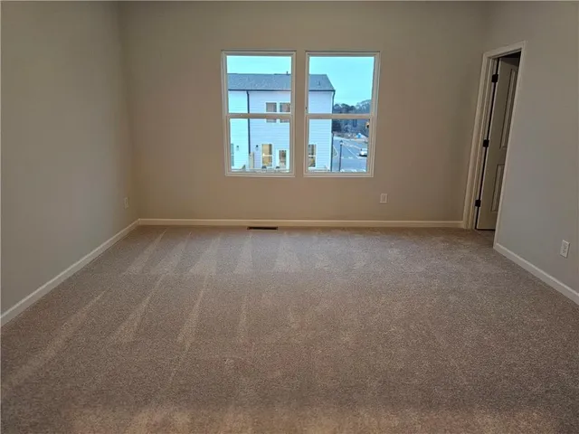an empty room that has a window