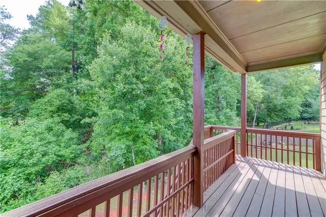 a view of a house with brick walls and a small yard