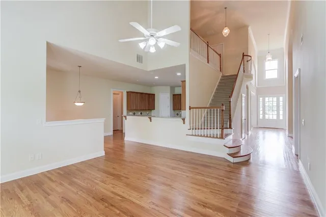 a view of an entryway with wooden floors