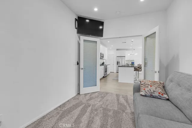 a view of a bedroom with a bed and couch