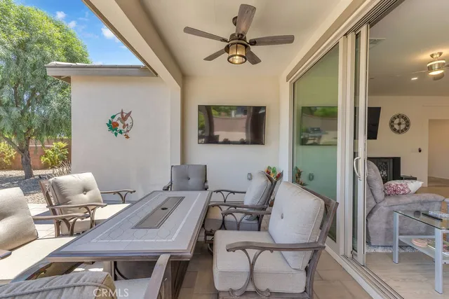 a view of a livingroom with furniture and a potted plant