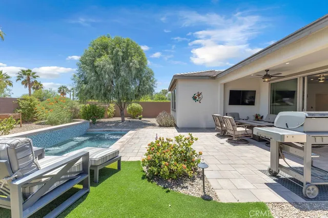 a view of a backyard with furniture