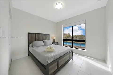 a kitchen with a sink cabinets and stainless steel appliances