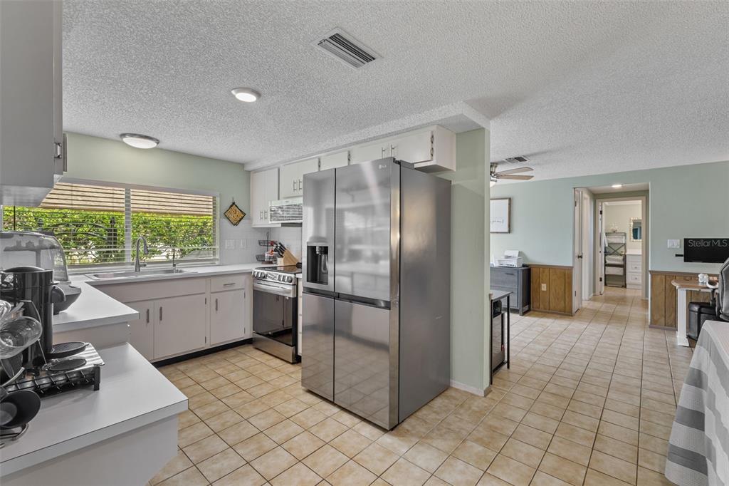 12111 Fieldstone Lane Hudson, FL 34667 - Photo 20 of 49 a kitchen with stainless steel appliances a refrigerator sink and microwave