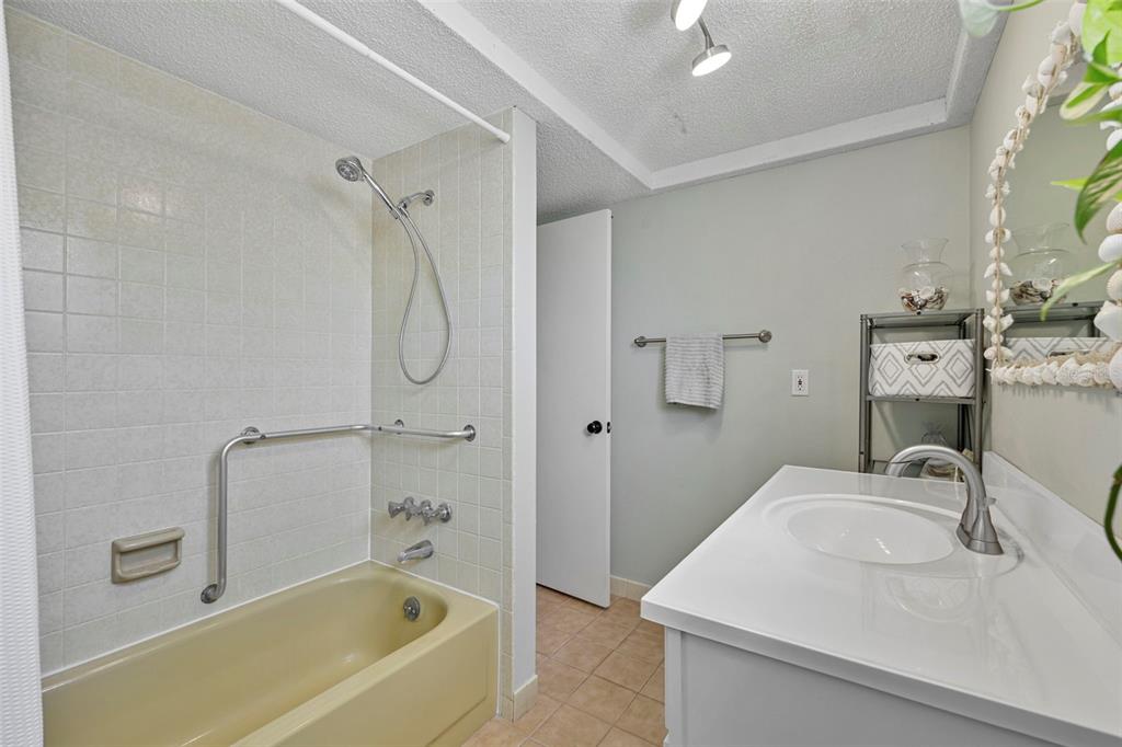 12111 Fieldstone Lane Hudson, FL 34667 - Photo 23 of 49 a bathroom with a granite countertop sink a toilet and shower