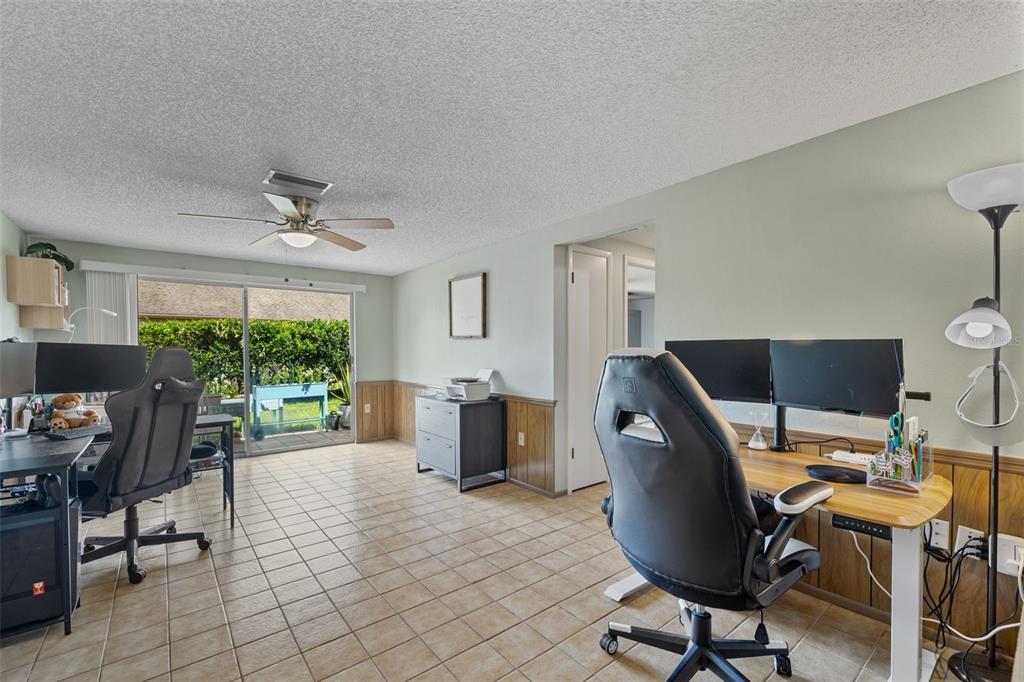 12111 Fieldstone Lane Hudson, FL 34667 - Photo 27 of 49 a workspace with furniture window and outside view