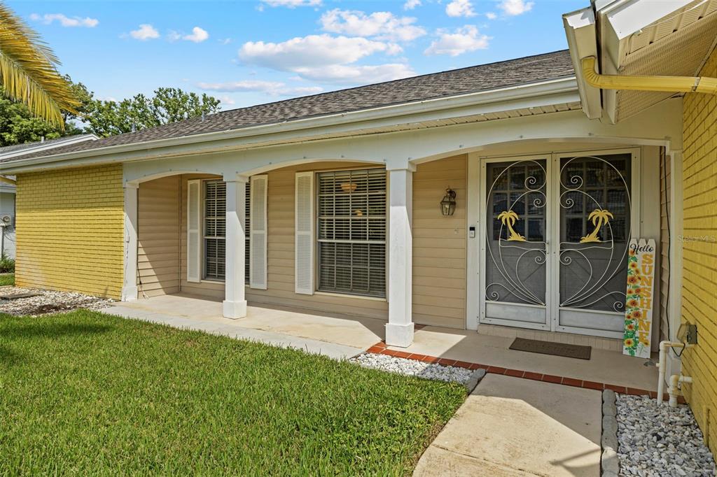 12111 Fieldstone Lane Hudson, FL 34667 - Photo 34 of 49 front view of a house with a yard