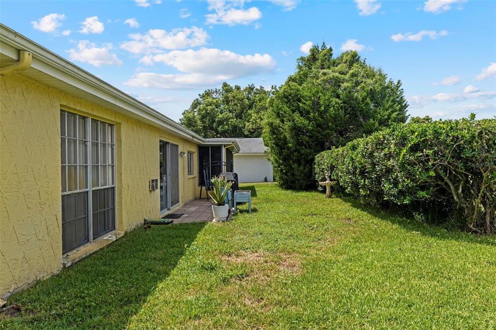 12111 Fieldstone Lane Hudson, FL 34667 - Photo 38 of 49 a house view with a garden space