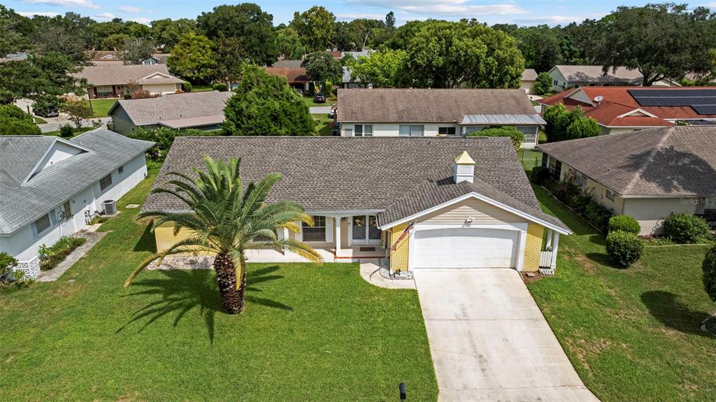 12111 Fieldstone Lane Hudson, FL 34667 - Photo 39 of 49 a aerial view of a house next to a yard
