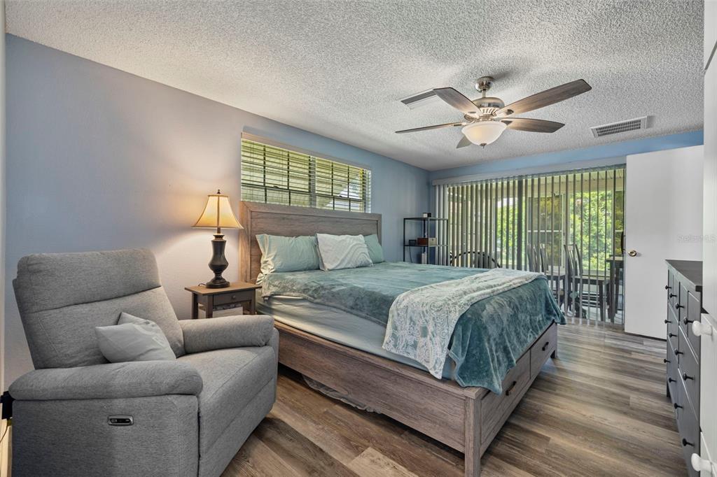 12111 Fieldstone Lane Hudson, FL 34667 - Photo 4 of 49 a bedroom with a bed couch and window