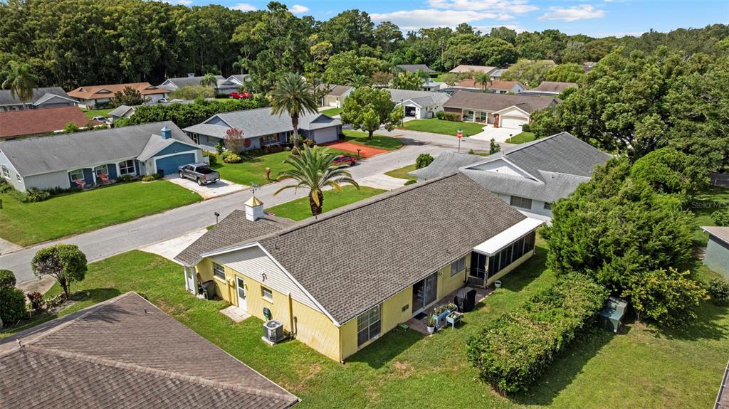 12111 Fieldstone Lane Hudson, FL 34667 - Photo 42 of 49 an aerial view of a house with a garden