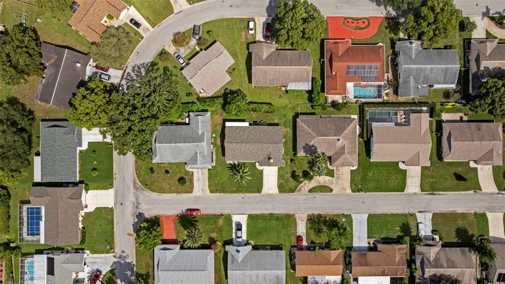 12111 Fieldstone Lane Hudson, FL 34667 - Photo 48 of 49 an aerial view of multiple houses with a yard