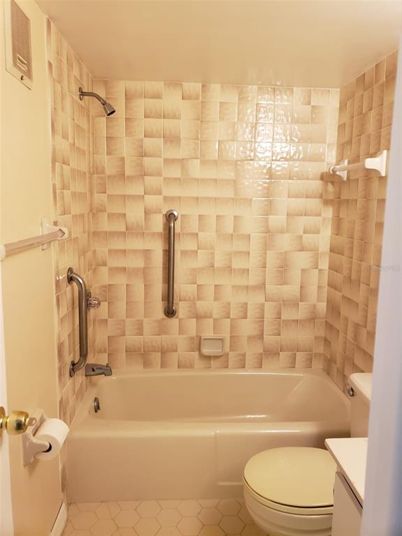 25225 Rampart Boulevard, Unit 2001 Punta Gorda, FL 33983 - Photo 5 of 6 a bathroom with a toilet and shower