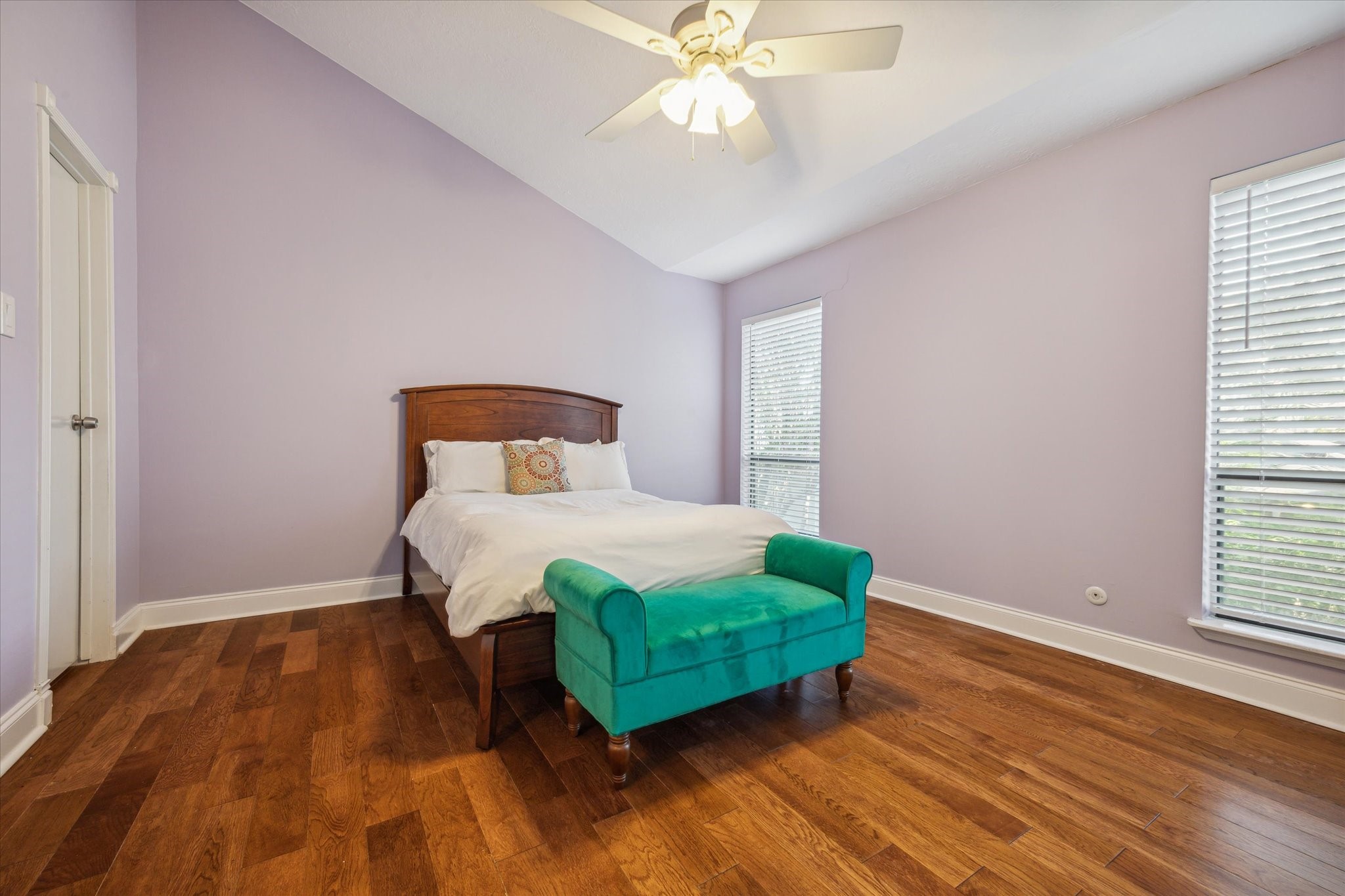 2107 Morgan Street Houston, TX 77006 - Photo 11 of 13 Secondary ensuite bedroom with soaring ceilings, hardwood floors & generous natural light.