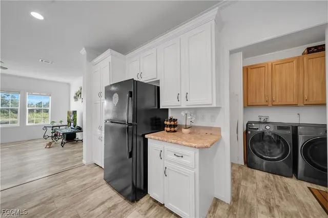a kitchen with a refrigerator stove and microwave