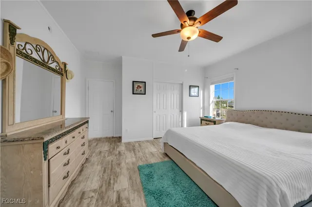 a spacious bathroom with a double vanity sink a mirror and a shower