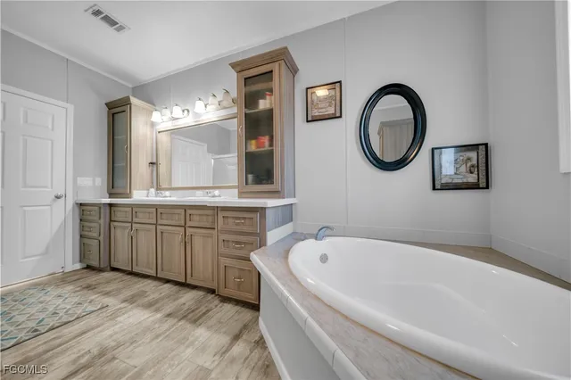 a bathroom with a toilet a sink and a mirror