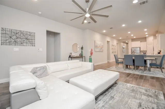 a view of a workspace with furniture and a potted plant