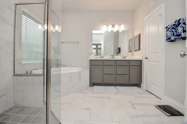 a bathroom with a shower and bathtub