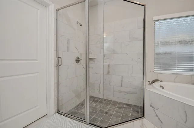 a white bath tub sitting in a bathroom