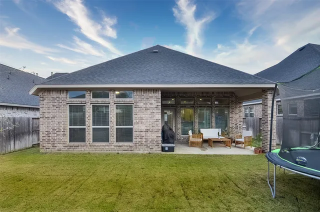 front view of a house with a garden