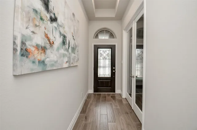a kitchen with a sink microwave and cabinets
