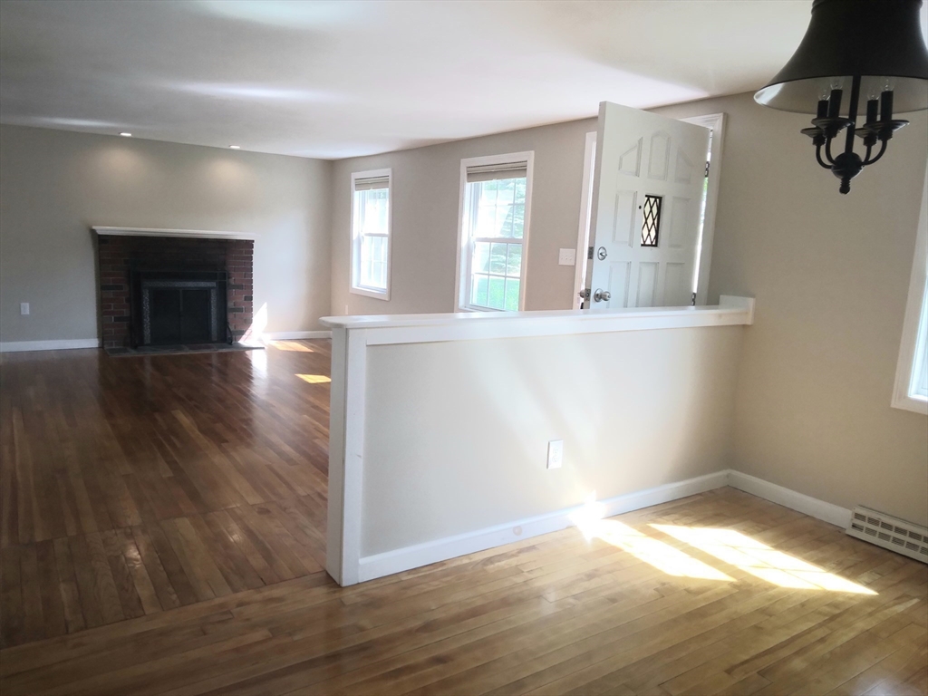 42 Lowell Road Pepperell, MA 01463 - Photo 13 of 32 wooden floor in an empty room with a window