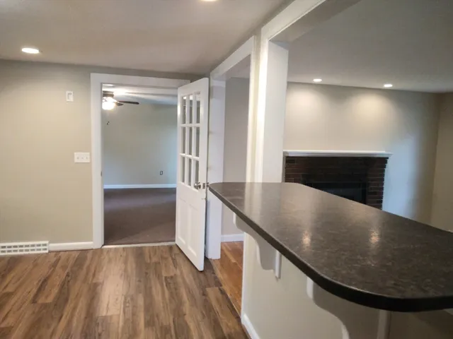 a view of kitchen and wooden floor