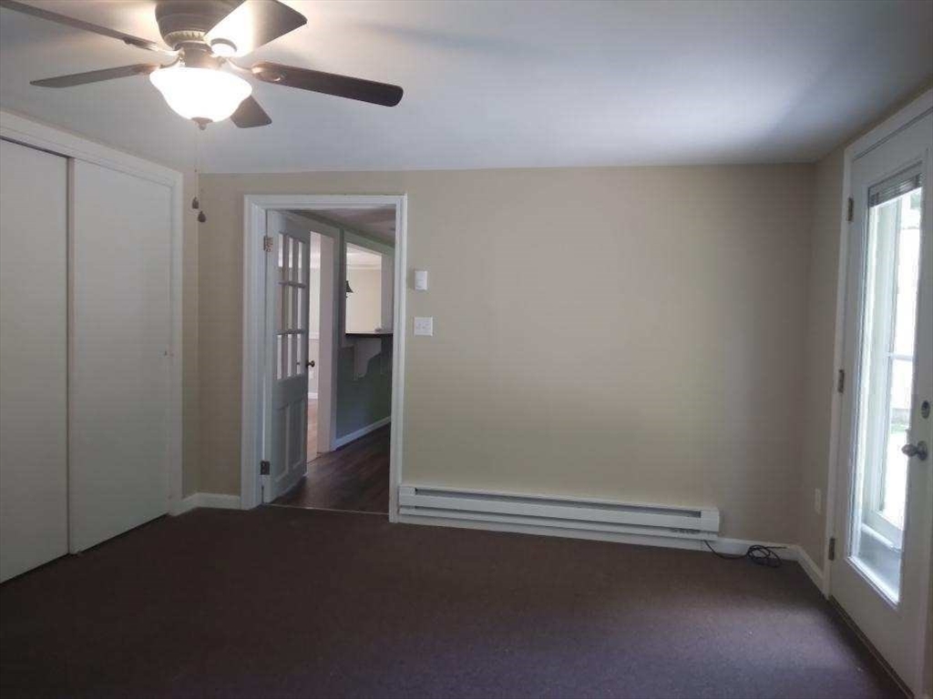 42 Lowell Road Pepperell, MA 01463 - Photo 17 of 32 an empty room with windows and fan view