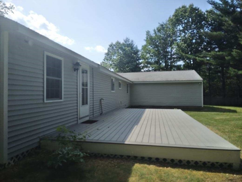 42 Lowell Road Pepperell, MA 01463 - Photo 19 of 32 a view of backyard with a tub and trees