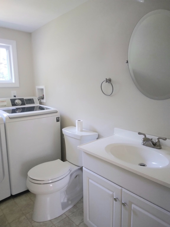 42 Lowell Road Pepperell, MA 01463 - Photo 28 of 32 a bathroom with a granite countertop toilet a sink and mirror