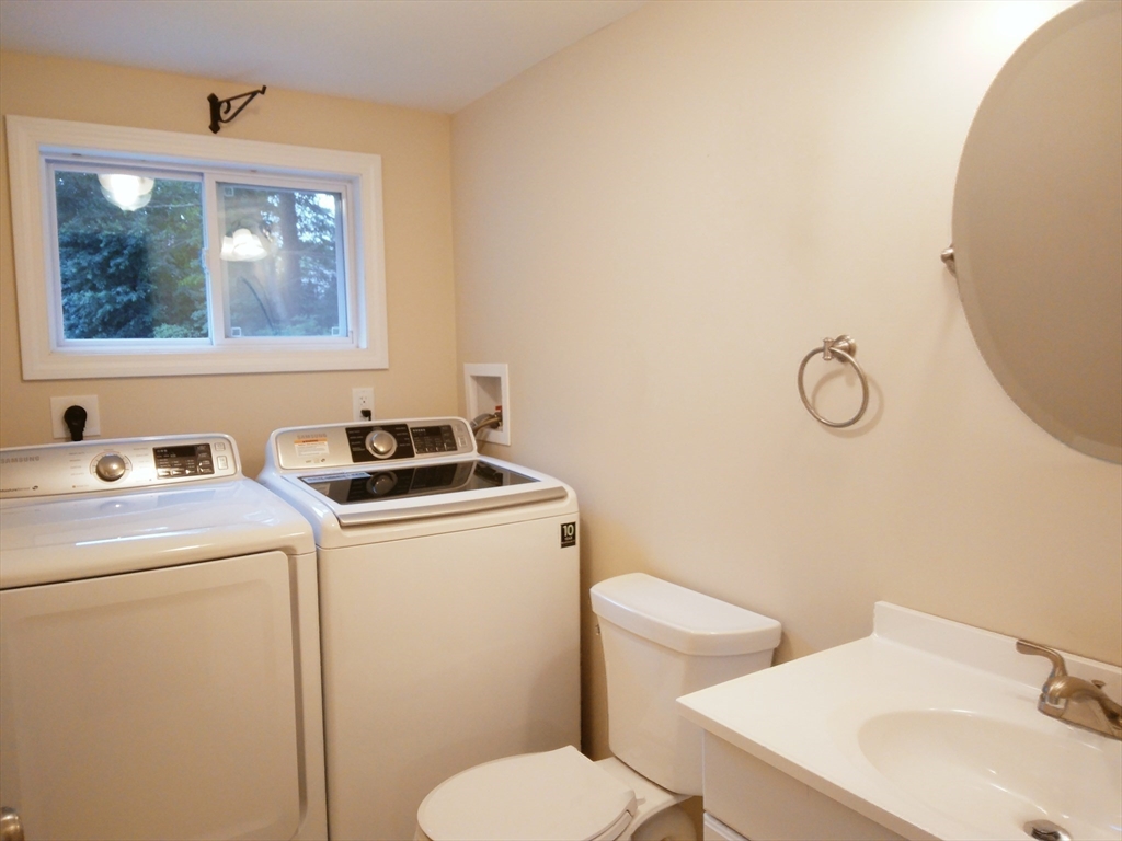 42 Lowell Road Pepperell, MA 01463 - Photo 29 of 32 a bathroom with a toilet a sink and a mirror