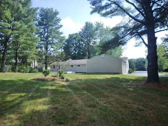 a backyard of a house with lots of green space