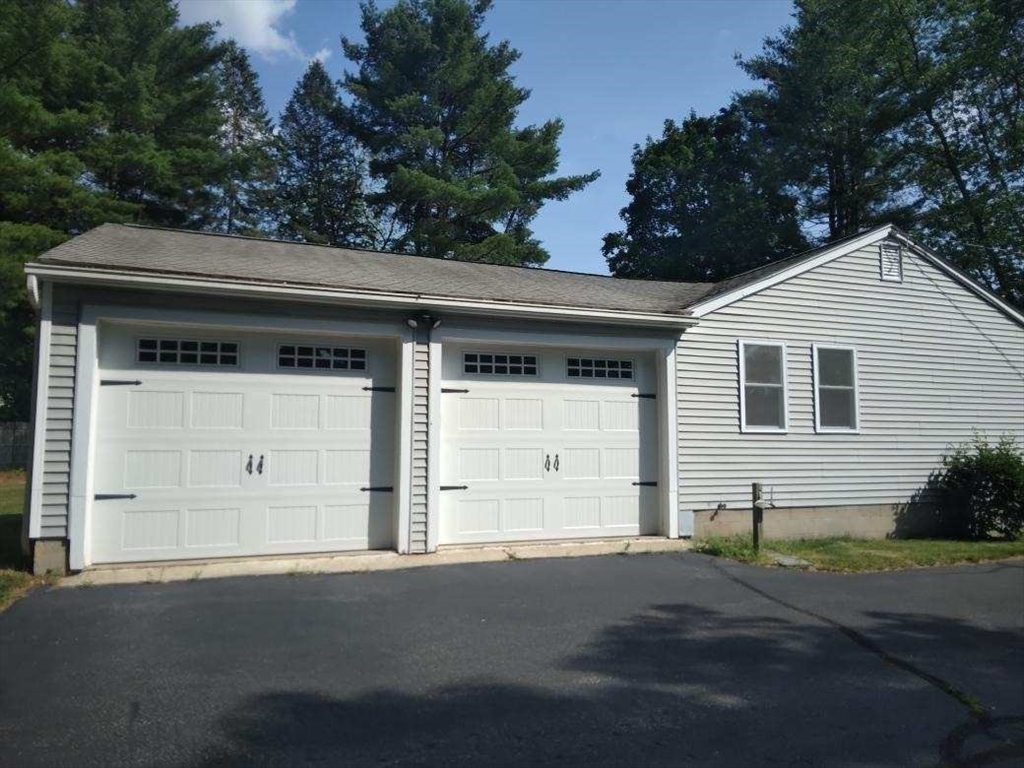 42 Lowell Road Pepperell, MA 01463 - Photo 4 of 32 a front view of a house