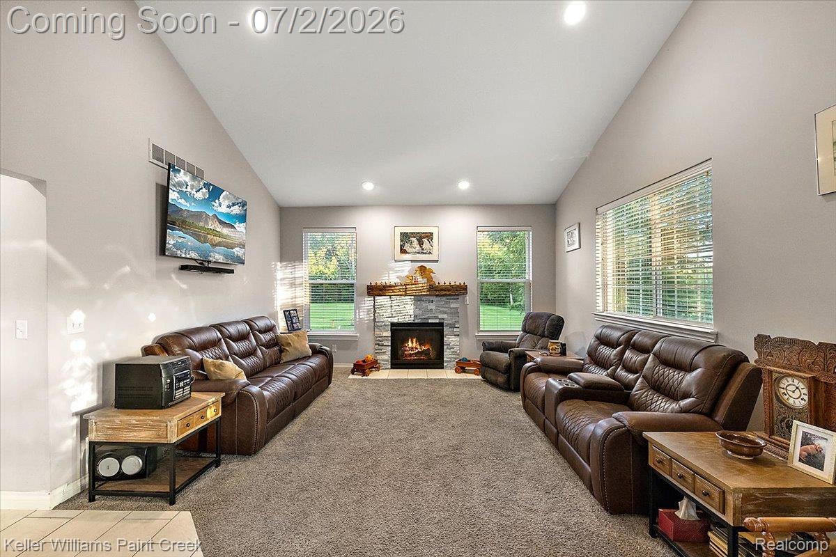 54230 Card Road Macomb, MI 48042 - Photo 46 of 73 Spacious living area featuring a vaulted ceiling with recessed lighting