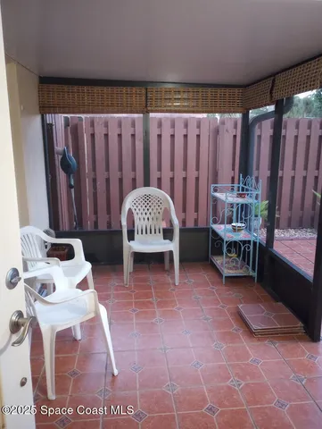 a view of a room with furniture and a rug