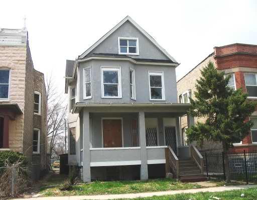5620 South Green Street Chicago, IL 60621 - Photo 1 of 1 a front view of a house with a yard