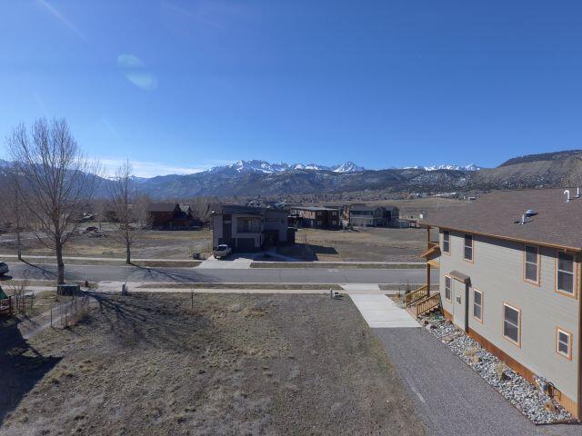 Tbd Marion Overlook Ridgway, CO 81432 - Photo 4 of 11 a view of a house with a yard and mountain view