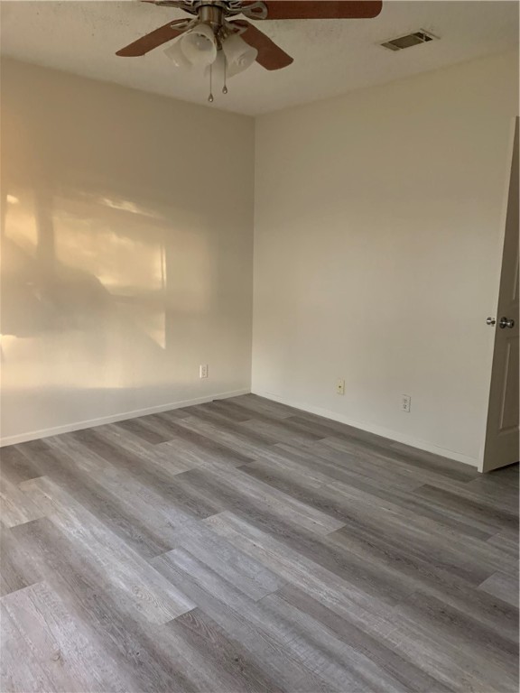 12316 Cahone Trail, Unit B Austin, TX 78729 - Photo 7 of 10 back bedroom with new beautiful flooring