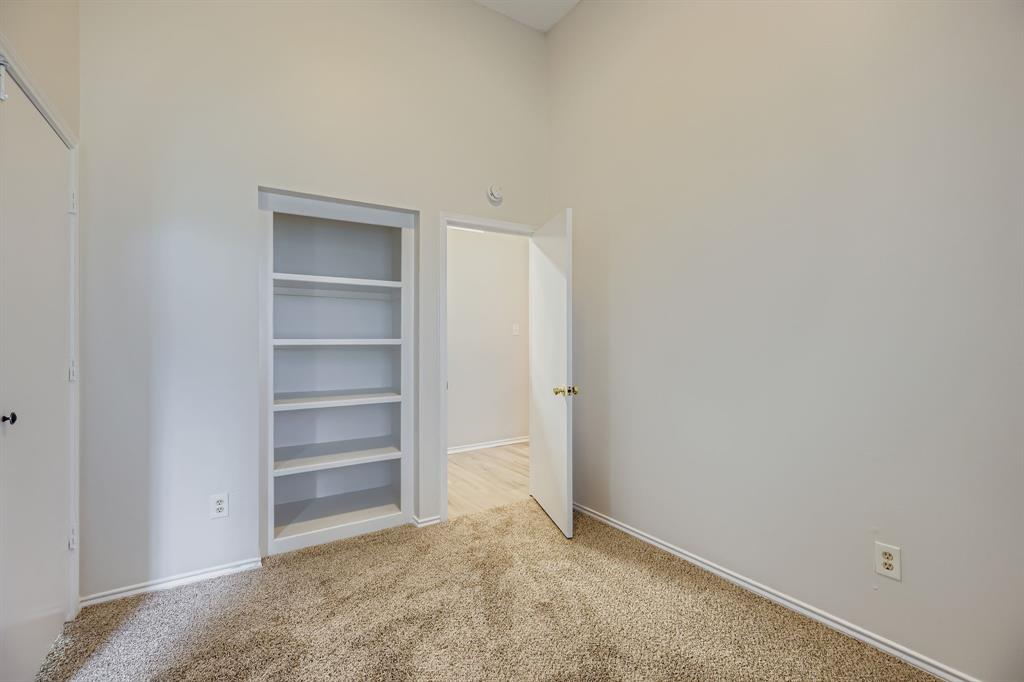 4319 Harvest Hill Road Carrollton, TX 75010 - Photo 15 of 28 Unfurnished bedroom with light colored carpet and a towering ceiling