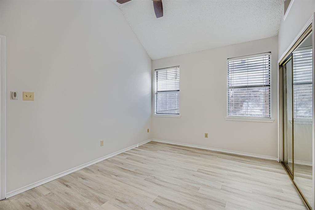 4319 Harvest Hill Road Carrollton, TX 75010 - Photo 17 of 28 Unfurnished bedroom with vaulted ceiling, light wood-style floors, a closet, and a ceiling fan